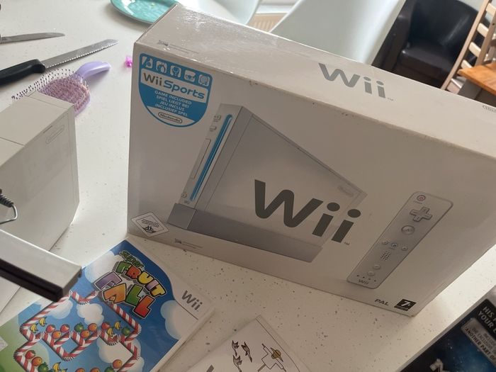wii console , games and 2 controllers