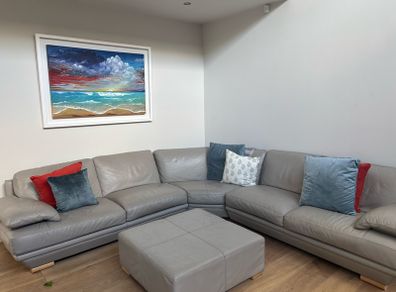 Taupe grey leather couch
