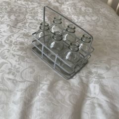6 mini glass bottles in holder