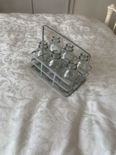 6 mini glass bottles in holder