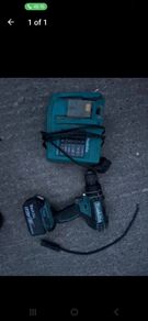 Makita 18V LXT Combi Drill paired with a Makita BL1830 3.0Ah Battery and the DC18RC LXT Fast Charger