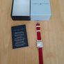 Tommy Hilfiger watch features a distinctive rectangular stainless steel case and a reversible red, white, and blue leather strap Image 6