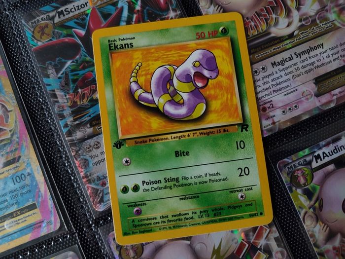 Ekans ! FIRST EDITION ! Rare Near Mint- Mint Condition ! from Team Rocket Set ! 2000 ! Pokemon Card !