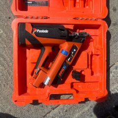 Paslode PPNXi cordless gas nailer in original orange carry case.