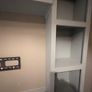Large custom-built fitted media wall / TV unit in very good used condition. Image 3