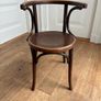 A vintage 1920s Thonet style bentwood chair with armrests. Image 8