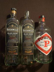 Bushmills black bush powers whiskey Empty bottles