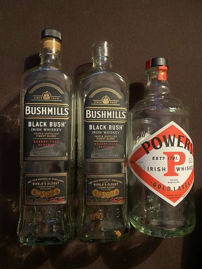 Bushmills black bush powers whiskey Empty bottles