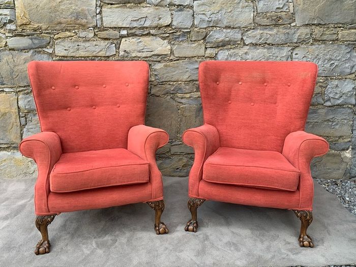 A pair of Chippendale Revival Country House wingback armchairs on Ball & Claw feet.