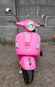 Pink Vespa GTS Super electric ride-on scooter