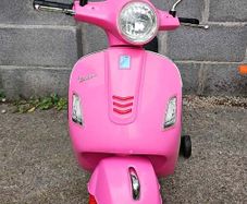 Pink Vespa GTS Super electric ride-on scooter