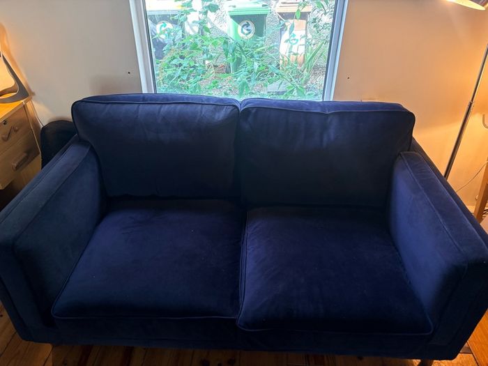 Two seater couch in navy velvet for sale