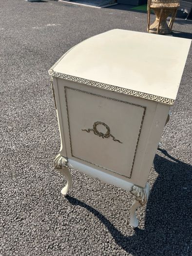 Vintage Olympus cream and gilt Louis style chest of drawers featuring bow-front drawers and cabriole legs.