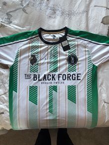 A brand new black forge away jersey (Signed by Conor McGregor)