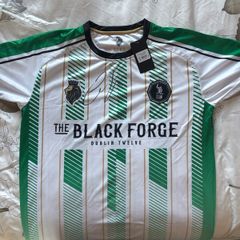A brand new black forge away jersey (Signed by Conor McGregor)