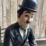 Charlie Chaplin resin sculpture figurine in metal chair Image 3