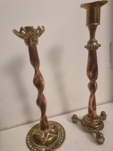 Two unusual gothic brass and copper candlesticks