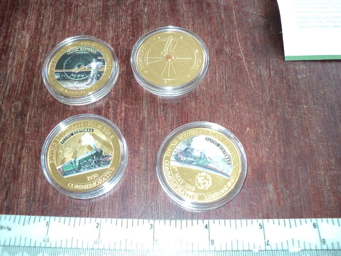 4 Flying Scotsman commemorative coins .