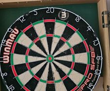 Dartboard + 7 sets of darts + spares - job lot