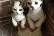 Tall vintage ceramic cats in basket with metal hooks