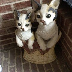 Tall vintage ceramic cats in basket with metal hooks