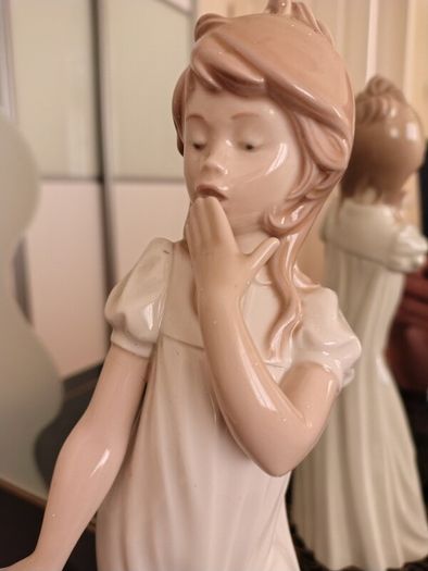 Nao by Lladro.  Yawning Girl. Damaged.