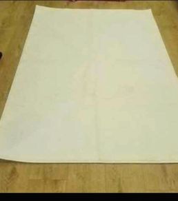 Brand new large long pile cream rug selling for 30 euro .Have matching smaller one will sell both for 40