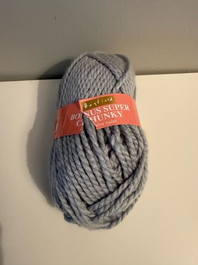 5 balls of grey yarn wool