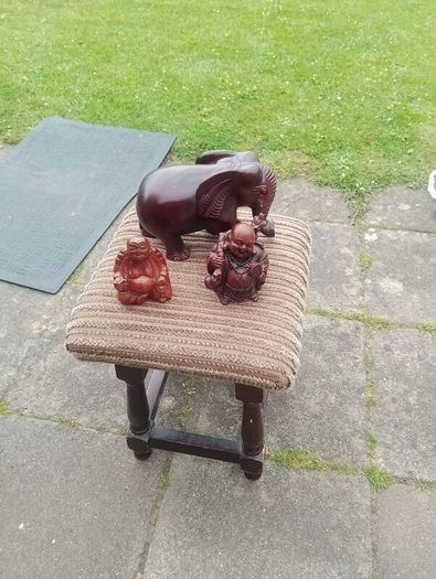 carved wooden elephant and 2 Buddha