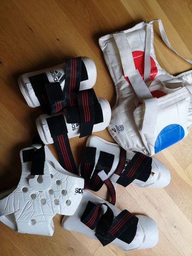 Taekwando protective gear - child. Arm guards, shin and foot guards, chest guard and head gear.