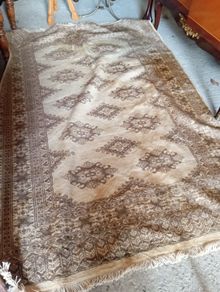 Vintage handwoven fringed rug.