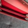 Michael Kors red and pink wallet with gold-tone MK logo. Multiple card slots and a zipped coin compartment. In perfect condition apart from some minor wear inside, which is not noticeable when using it, as shown in the photos. Image 10