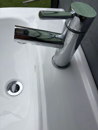 Sink with pedestal and tap