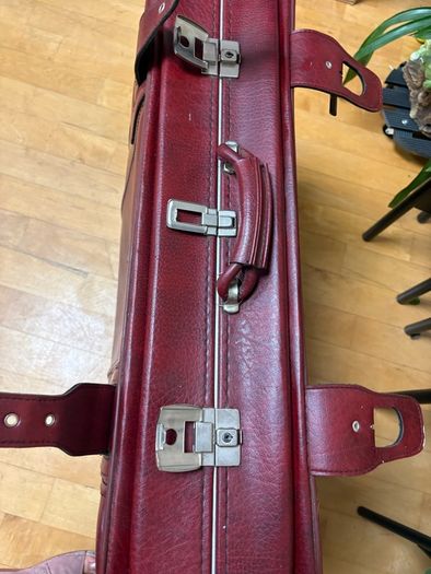 Vintage burgundy faux-leather suitcase