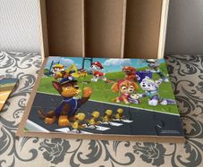 3 Paw patrol puzzles with wooden storage box & base