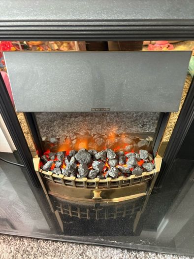 Fireplace with electric inset.