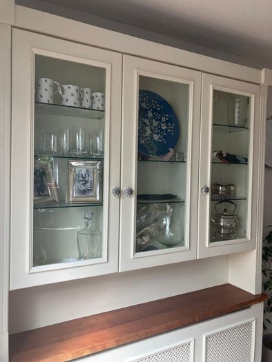 Radiator cover and display unit