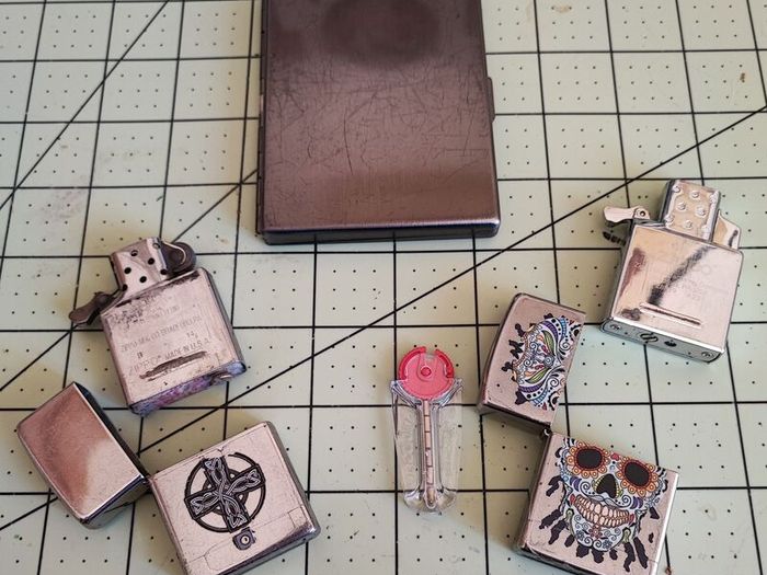 Old Zippos, Zippo flints, and a steel smokes case