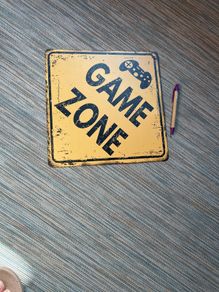 Game Zone metal sign