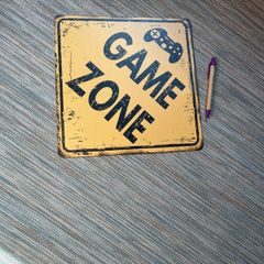 Game Zone metal sign