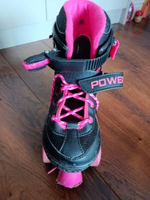 Black & pink rollerskates size 3 to 5.