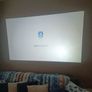 philips neopix ultra 2tv+ home projector and height adjustable stand, built in speakers and android TV with play store stand comes with power point bracket on it as seen in pictures also remote and phone holder Image 2