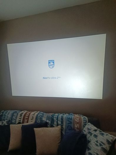 philips neopix ultra 2tv+ home projector and height adjustable stand, built in speakers and android TV with play store stand comes with power point bracket on it as seen in pictures also remote and phone holder