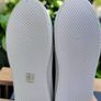 Black sneakers with thick white sole Image 3