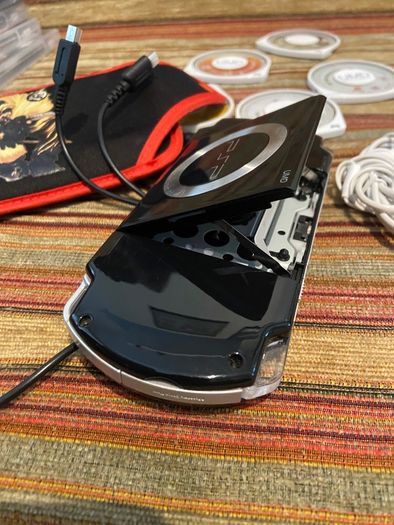 PSP  Console plus 10 games, charger and headphones