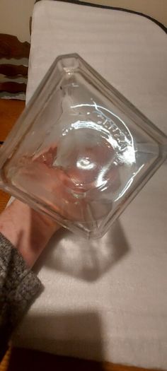 Art deco glass whiskey decanter with lid,,buyer collects or pays postage thank you, good patina condition,,sold as is, see pictures for condition,,