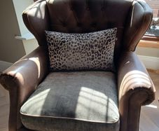 Chesterfield couch & 2 single chairs in brown leather and sage green cushions. Perfect condition,  non smokers, no house pets.  Couch Width 7ft, Depth 4ft. Chairs Width 3ft2ins, Depth 3ft