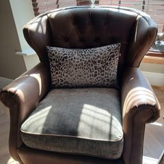 Chesterfield couch & 2 single chairs in brown leather and sage green cushions. Perfect condition,  non smokers, no house pets.  Couch Width 7ft, Depth 4ft. Chairs Width 3ft2ins, Depth 3ft