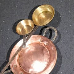 Large antique copper and brass pans