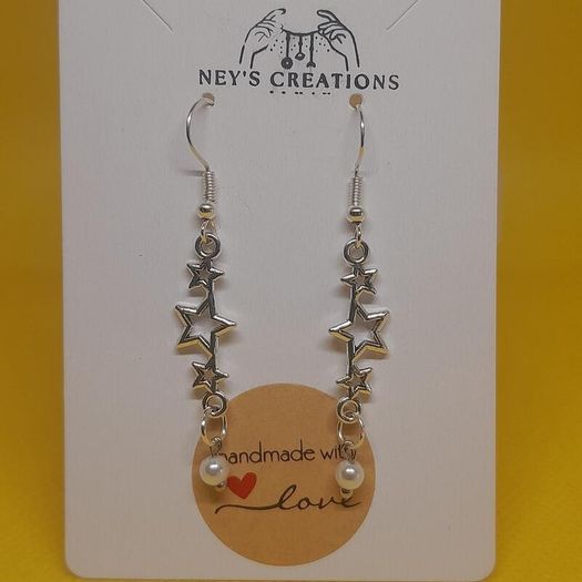 Starry Dreams drop earrings with star charms and pearl detail